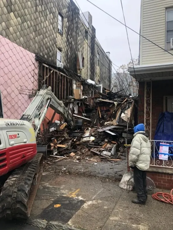 Demolition and site preparation with excavator
